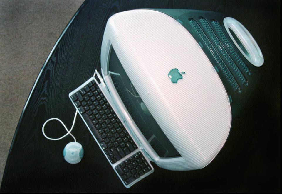 In this Aug. 13, 1998 file photo, Apple’s new iMAC computer is seen at Apple headquarters in Cupertino, Calif. Apple has become the world’s first company to be valued at $1 trillion, the financial fruit of tasteful technology that has redefined society since two mavericks named Steve started the company 42 years ago. (AP Photo/Ben Margot)