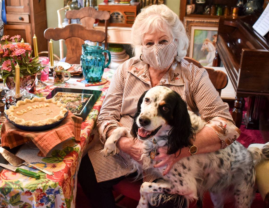 Lexington cookbook author Barbara Harper-Bach, with her dog Butler, and a cushaw pie that she made from her own recipe. “I told my kids it was a pumpkin pie, because I didn’t think they’d eat anything called cushaw. And they said it was the best pumpkin pie they ever ate. And that’s exactly why we’re still making it today.”