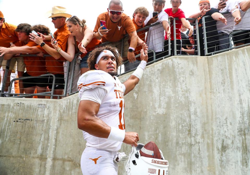 Texas quarterback Casey Thompson greets fans after the 32-27 win over TCU in 2021 in Fort Worth. He ended up transferring to Nebraska that following year and is currently playing for former Texas coach Tom Herman at Florida Atlantic.