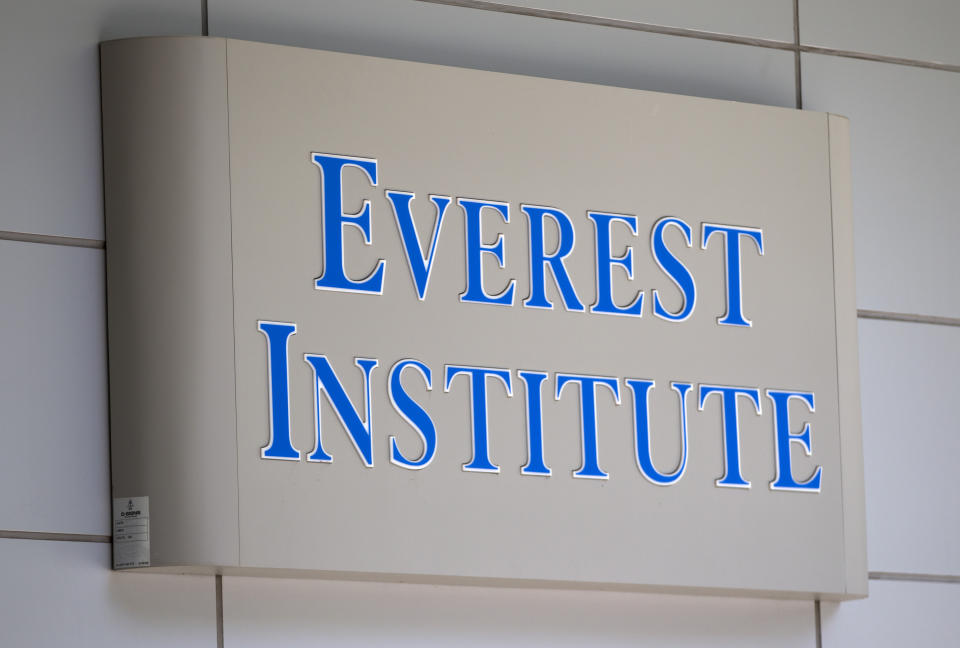 FILE - In this July 8, 2014 file photo, an Everest Institute sign is seen in an office building in Silver Spring, Md. Hundreds of thousands of students who attended the for-profit Corinthian Colleges chain, including Everest Institute, will automatically get their federal student loans canceled, the Biden administration announced Wednesday, June 1, 2022, a move that aims to bring closure to one of the most notorious cases of fraud in American higher education. (AP Photo/Jose Luis Magana, File)