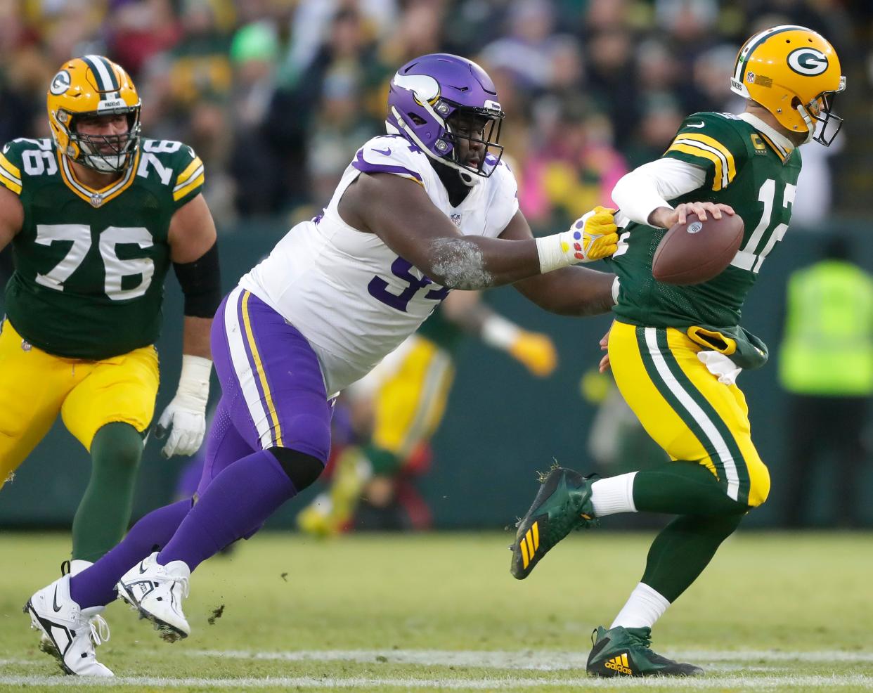 Minnesota Vikings defensive tackle Dalvin Tomlinson (94) pressures Green Bay Packers quarterback Aaron Rodgers (12) causing a fumble during their football game on Sunday, January, 1, 2023 at Lambeau Field in Green Bay, Wis. Wm. Glasheen USA TODAY NETWORK-Wisconsin