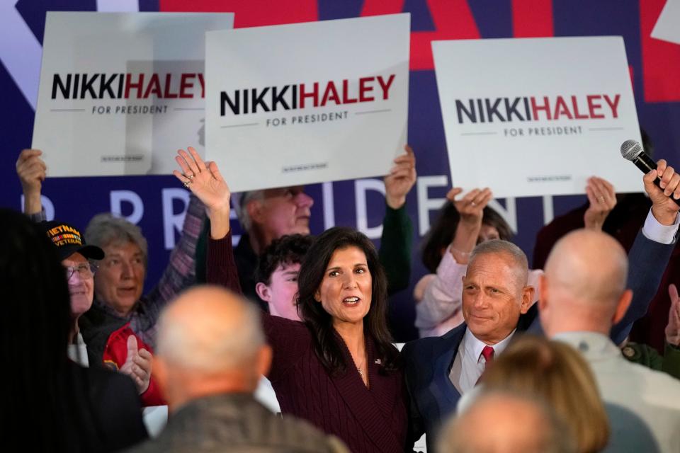 Republican presidential candidate Nikki Haley acknowledges applause with former Republican Senate candidate Don Bolduc during a town hall campaign event, Thursday, Feb. 16, 2023, in Exeter, N.H. (AP Photo/Robert F. Bukaty) ORG XMIT: NHRB105