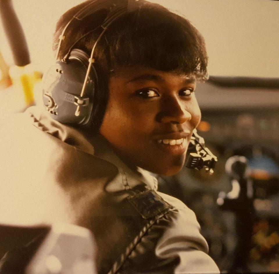 Theresa Claiborne sits in the cockpit of a KC-135 aircraft in 1989.  She became the first black female command pilot and instructor for the KC-135.