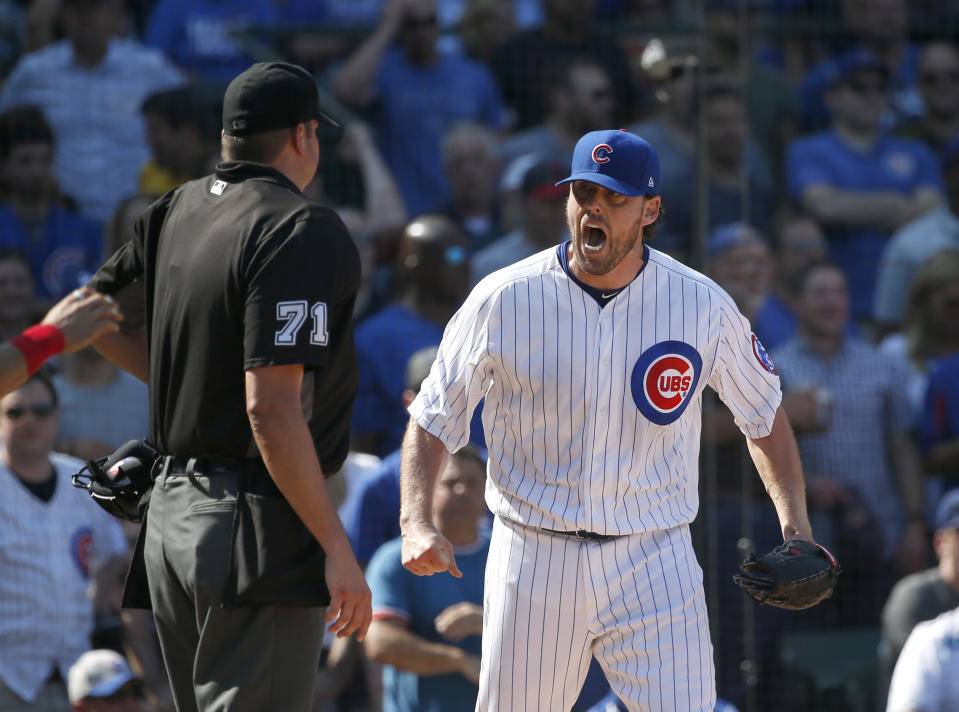 John Lackey screaming at umpire Jordan Baker during Friday's game. (AP)