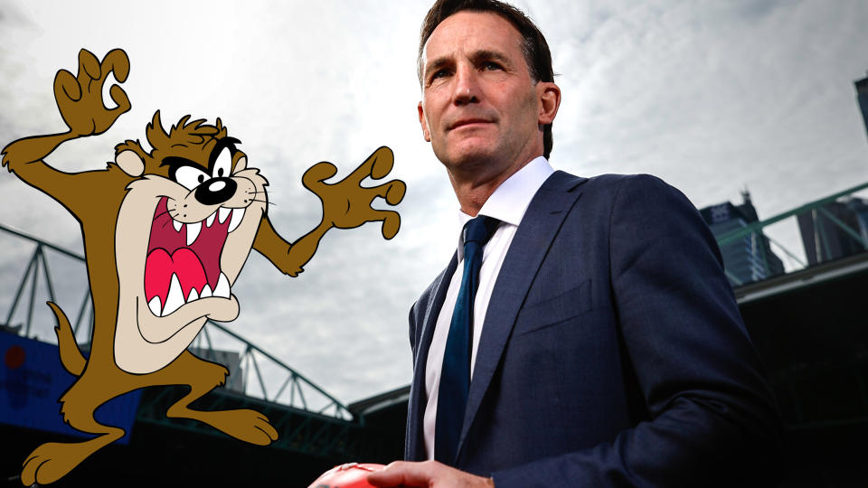 AFL CEO Andrew Dillon is pictured with an inset of Looney Tunes character, the Tasmanian Devil.