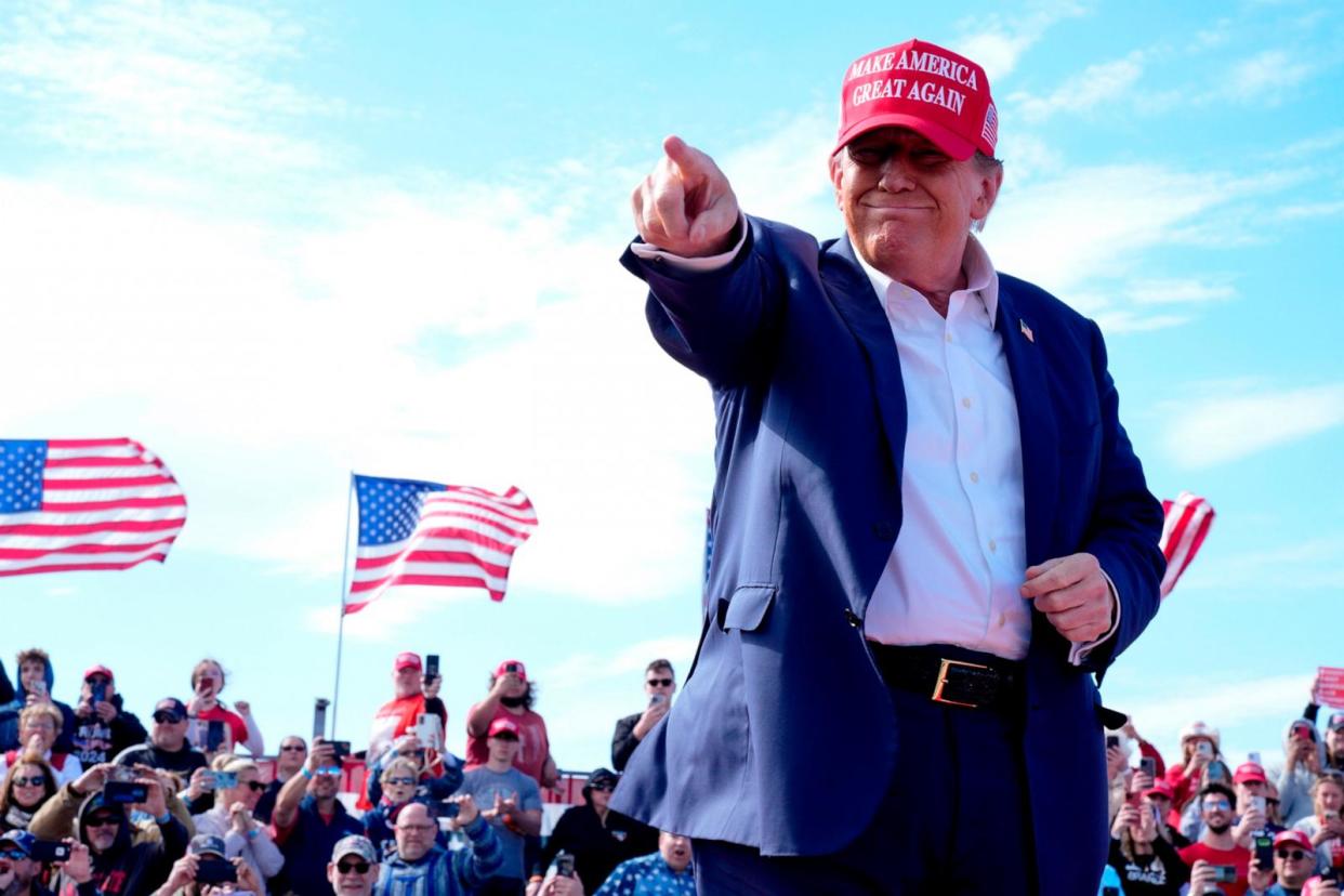 PHOTO: Republican presidential candidate former President Donald Trump gestures to the crowd at a campaign rally, on March 16, 2024, in Vandalia, Ohio. (Jeff Dean/AP)