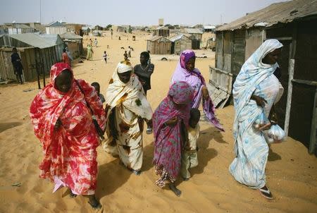 Mauritanians ex-slaves walk in a suburb outside Mauritania's capital Nouakchott in a file photo. REUTERS/Rafael Marchante