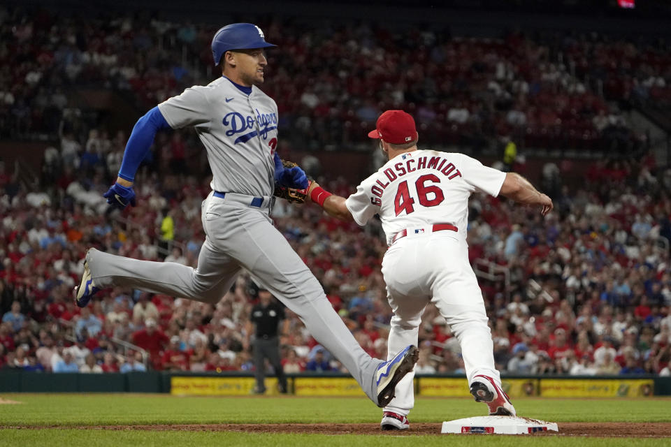 Los Angeles Dodgers' Trayce Thompson, left, grounds out as St. Louis Cardinals first baseman Paul Goldschmidt handles the throw during the fifth inning of a baseball game Tuesday, July 12, 2022, in St. Louis. (AP Photo/Jeff Roberson)