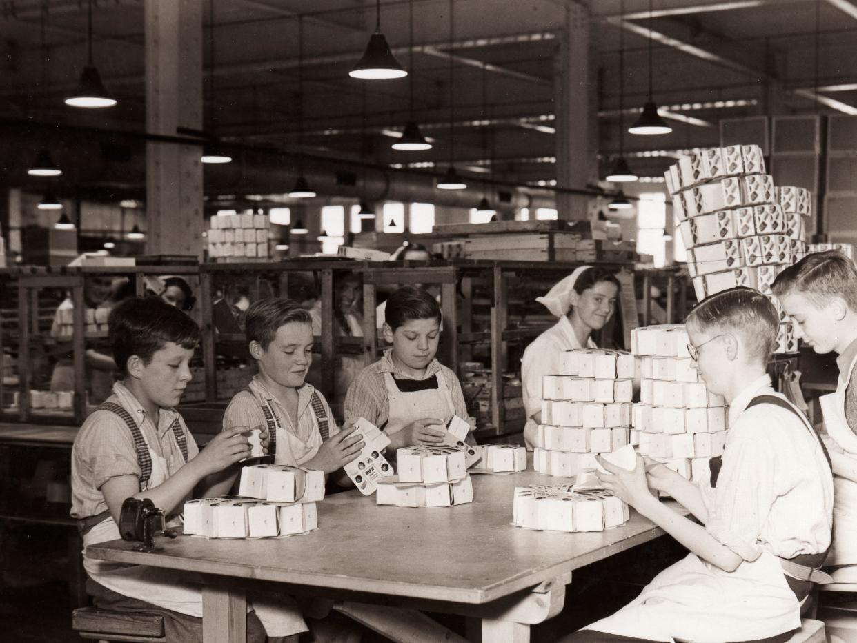 1940 photograph of boys working at a chocolate factory