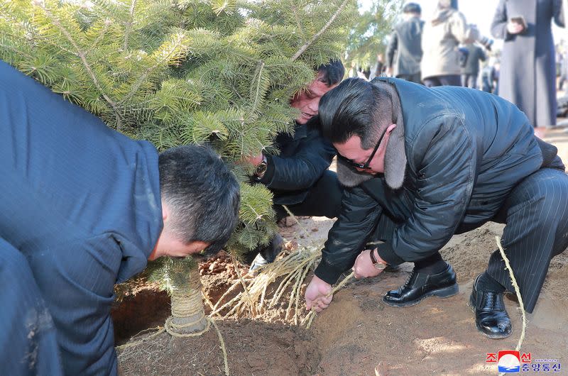 FILE PHOTO: North Korean leader Kim Jong Un takes part in an event to plant trees with the participants of the 2nd Conference of Secretaries of Primary Committees of the Workers' Party of Korea