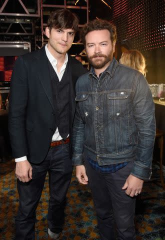 <p>Kevin Mazur/WireImage</p> Ahston Kutcher and Danny Masterson attend the 2017 CMT Music Awards on June 7, 2017