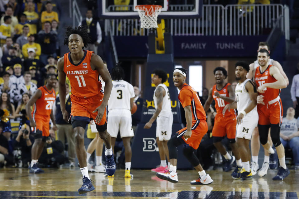 Illinois guard Ayo Dosunmu (11) runs up court after hitting the go-ahead score with less than second remaining during the second half of an NCAA college basketball game against Michigan, Saturday, Jan. 25, 2020, in Ann Arbor, Mich. (AP Photo/Carlos Osorio)