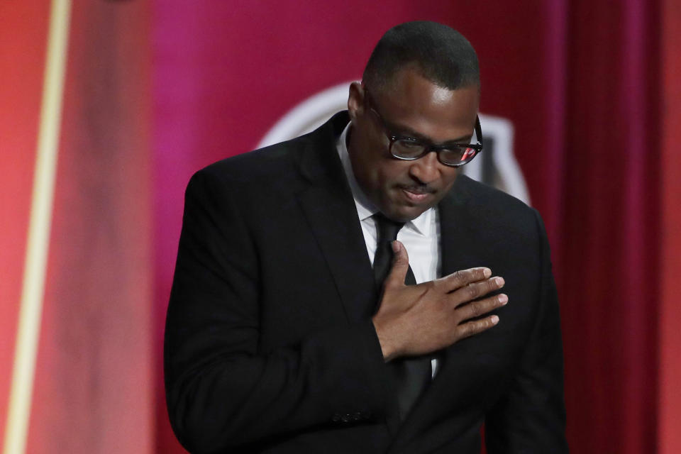 FILE - Chuck Cooper III reacts as his late father, Chuck Cooper, is inducted into the Basketball Hall of Fame on Friday, Sept. 6, 2019, in Springfield, Mass. Chuck Cooper was among the first Black players to play for Duquesne, helping open the door for others as the small school in downtown Pittsburgh became a national power in the 1940s and 1950s.(AP Photo/Elise Amendola, File)