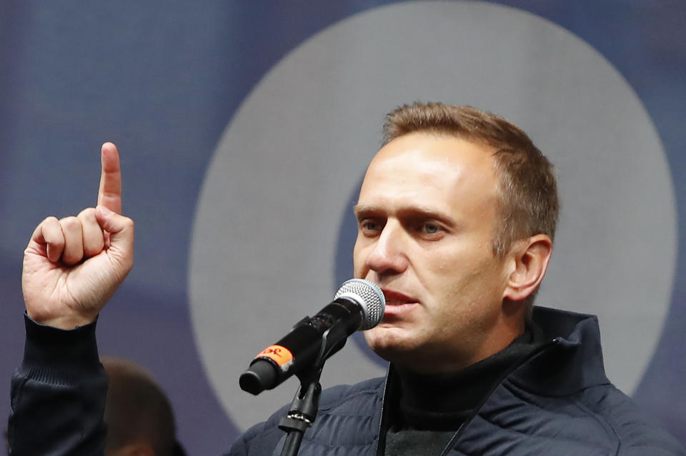 FILE - In this Sunday, Sept. 29, 2019 file photo Russian opposition leader Alexei Navalny speaks during a rally to support political prisoners in Moscow, Russia. The German hospital treating Russian opposition leader Alexei Navalny says he has been taking out of an induced coma and is responsive. Berlin's Charite hospital said Monday that Navalny's condition has further improved, allowing doctors to end the medically induced coma and gradually ease him off mechanical ventilation. (AP Photo/Dmitri Lovetsky, File)