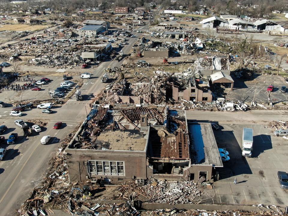 An aerial photo made with a drone shows widespread destruction of homes and businesses after tornadoes moved through the area leaving destruction and death across six states, in Mayfield, Kentucky, USA, 12 December 2021 (EPA)