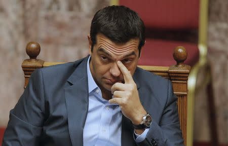 Greek Prime Minister Alexis Tsipras reacts as he attends a parliamentary session in Athens, Greece, August 14, 2015. REUTERS/Christian Hartmann