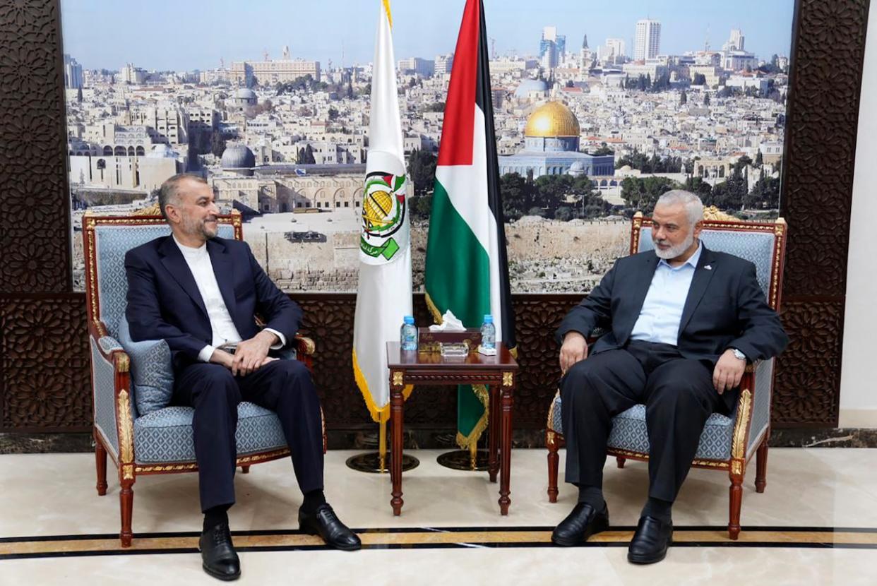 In this picture released by the Iranian Foreign Ministry, Iran's Foreign Minister Hossein Amirabdollahian, left, meets with Ismail Haniyeh, one of the leaders of the Palestinian militant group Hamas, in Doha, Qatar on Oct. 14, 2023. (Iranian Foreign Ministry via AP - image credit)