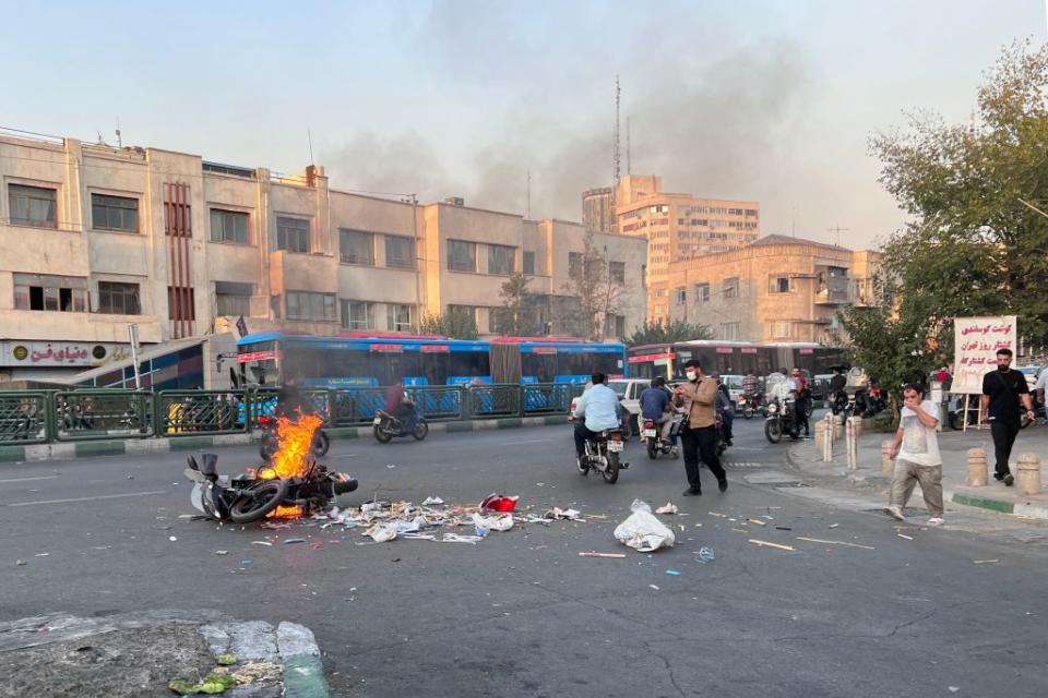 A picture obtained by AFP outside Iran, shows a motorcycle burning in the capital Tehran, during the current protests on October 8, 2022.<span class="copyright">AFP/Getty Images</span>