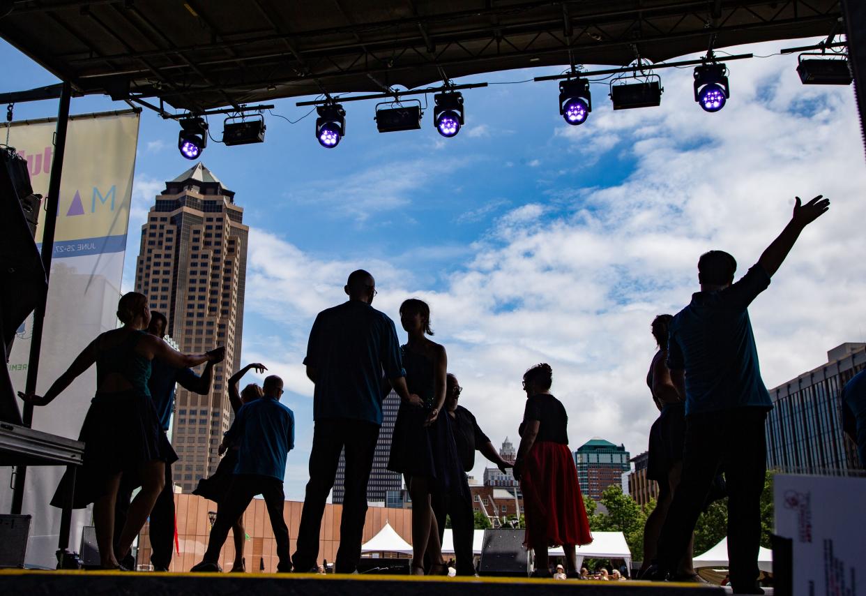 Dancers with Des Moines Ballroom Dance Studio perform Friday, June 25, 2021, during the first day of the 2021 Des Moines Arts Festival at Western Gateway Park in Des Moines.
