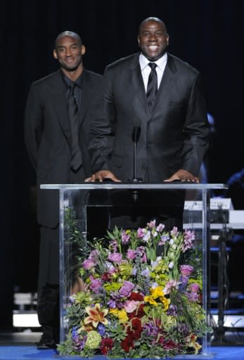 Los Angeles Lakers legends Kobe Bryant, left, and Magic Johnson speak at the 2009 Michael Jackson public memorial service staged at Staples Center