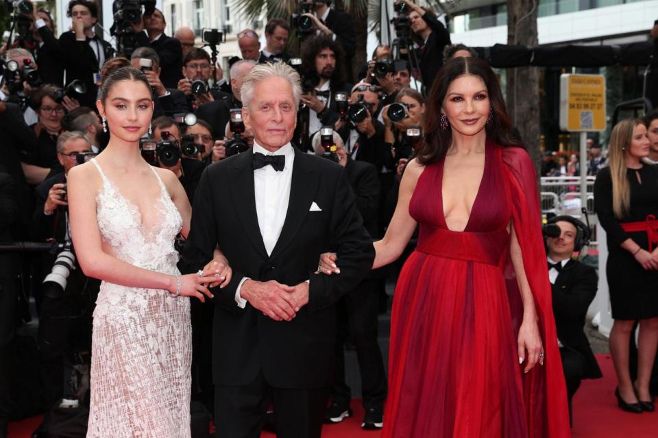 PHOTO: Carys Zeta Douglas, Michael Douglas and Catherine Zeta-Jones attend the 'Jeanne du Barry' Screening & opening ceremony red carpet at the 76th annual Cannes film festival at Palais des Festivals on May 16, 2023 in Cannes, France. (Gisela Schober/Getty Images)