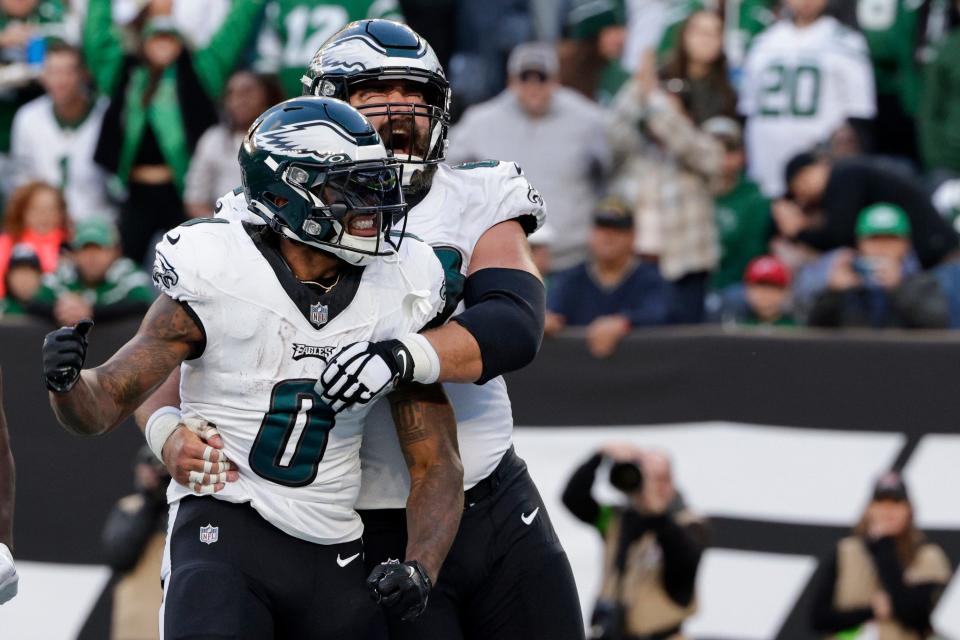 Philadelphia Eagles running back D'Andre Swift (0) celebrates his touchdown with center Jason Kelce (62) during the second quarter of an NFL football game, Sunday, Oct. 15, 2023, in East Rutherford NJ.