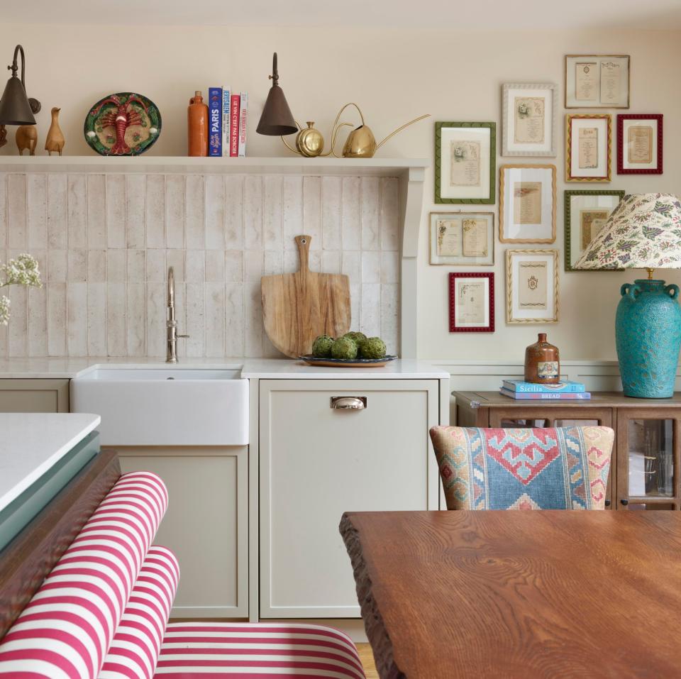 The built-in banquette is covered in a striped Flora Soames fabric