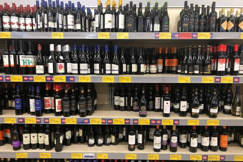 wine bottles on shelves in aldi