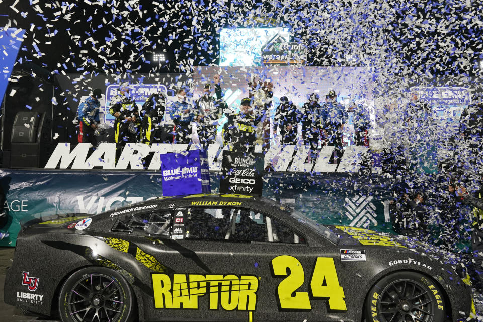 William Byron (24) is showered with confetti in Victory Lane after he won the NASCAR Cup Series auto race at Martinsville Speedway on Saturday, April 9, 2022, in Martinsville, Va. (AP Photo/Steve Helber)