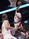 Toronto Raptors guard Javon Freeman-Liberty (0) dunks the ball during the first half of an NBA basketball game against the Brooklyn Nets in Toronto, Monday, March 25, 2024. (Nathan Denette/The Canadian Press via AP)