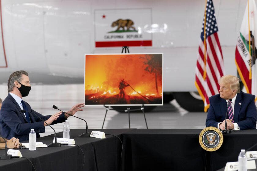 President Trump, right, participates in a briefing on wildfires with Calif. Gov. Gavin Newsom.