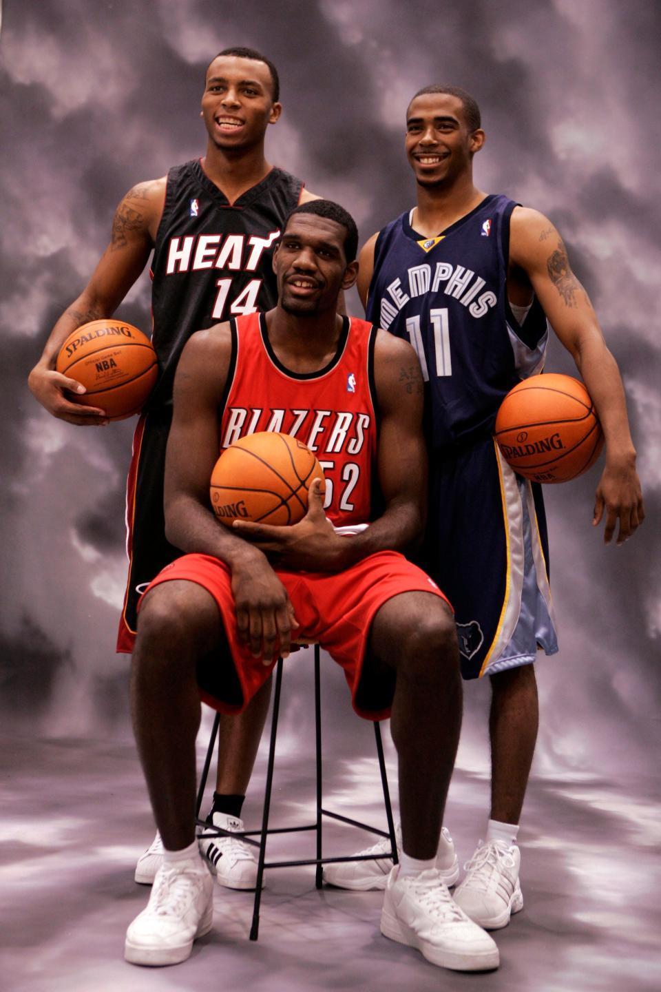 Former Ohio State basketball teammates Daequan Cook, left, Mike Conley Jr., right, and Greg oden, center, pose for photographs during the 2007 NBA Rookie Photo Shoot  Friday, July 27, 2007  in Tarrytown. N.Y.  (AP Photo/Frank Franklin II)