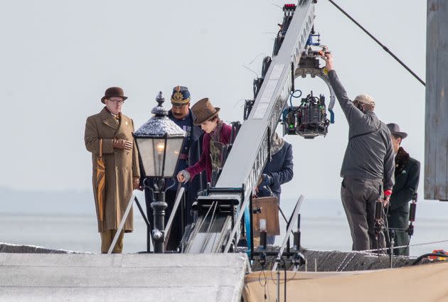 Timothée Chalamet is seen as Willy Wonka during filming for the Warner Bros. and Roald Dahl Story Co.'s upcoming movie 'Wonka' on Oct. 11 in Lyme Regis, England. This film will focus on the young Willy Wonka on his earliest adventure and how he met the Oompa-Loompas. (Photo: Finnbarr Webster via Getty Images)