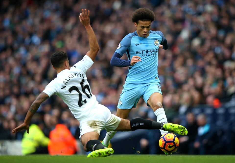 <p>Leroy Sane of Manchester City takes on Kyle Naughton of Swansea City during the Premier League match between Manchester City and Swansea City at Etihad Stadium on February 5, 2017 in Manchester, England. </p>