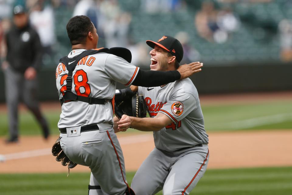 Orioles starting pitcher John Means and catcher Pedro Severino celebrate following the final out of Means' no-hitter against the Mariners.