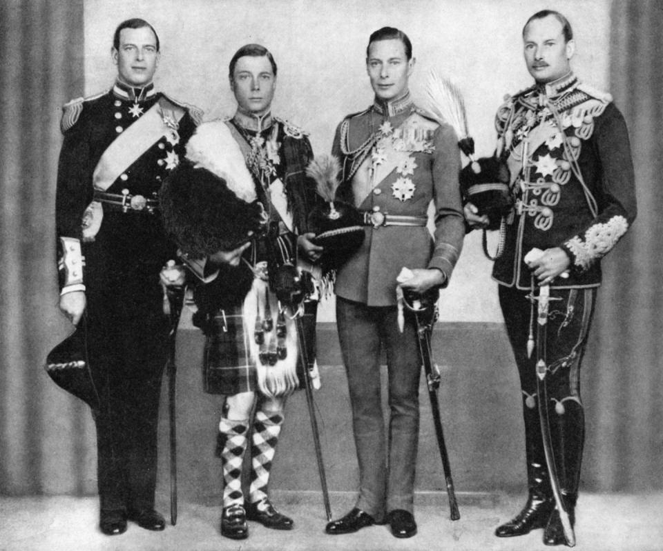 king edward viii and king george vi stand and look at the camera, both men are wearing decorated military uniforms