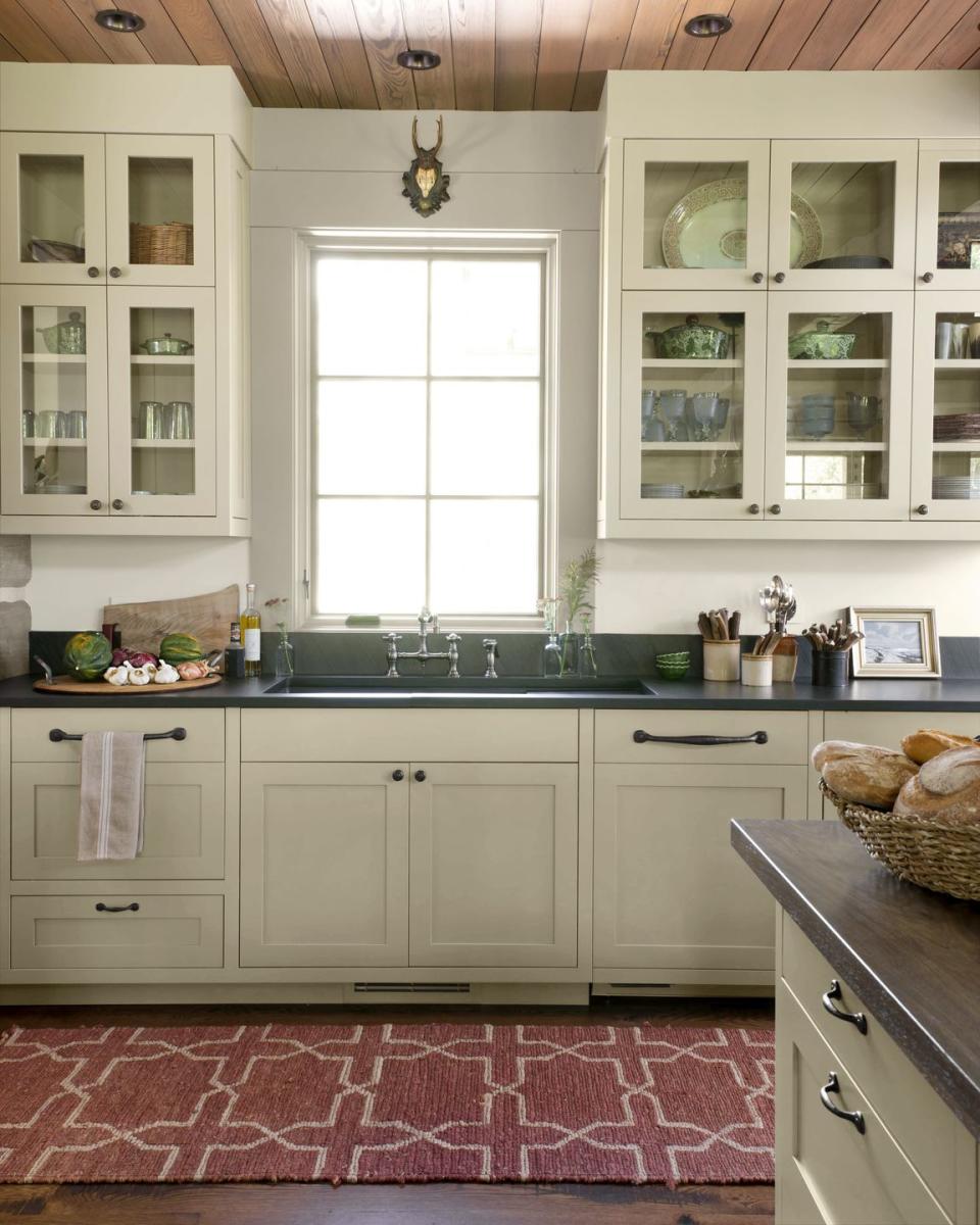 warm gray kitchen with muted red accent rug