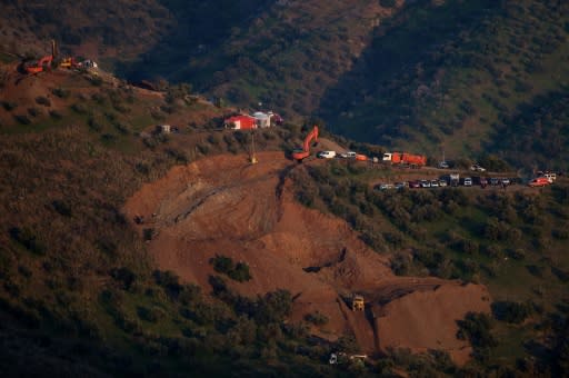 Rescue workers continue efforts to find a boy who fell down a well in Totalan in southern Spain