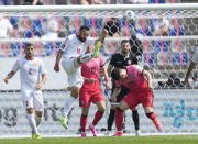 Lebanon's Nader Matar, center, kicks the ball away from South Korea's Kwon Chang-hoon during their Asian zone Group H qualifying soccer match for the FIFA World Cup Qatar 2022 at Goyang stadium in Goyang, South Korea, Sunday, June 13, 2021. (AP Photo/Lee Jin-man)