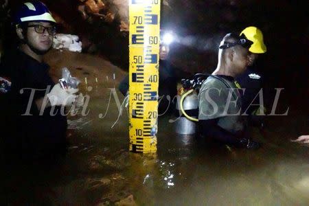 Rescue personnel work at the Tham Luang cave complex, as members of an under-16 soccer team and their coach have been found alive according to local media, in the northern province of Chiang Rai, Thailand July 4, 2018. Thai Navy Seal/Handout via REUTERS