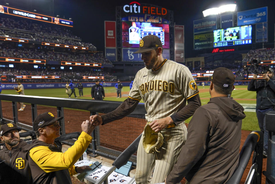 San Diego Padres starting pitcher Joe Musgrove (44) is greeted by manager Bob Melvin (3) as he comes off the field at the end of the sixth inning of Game 3 of a National League wild-card baseball playoff series against the New York Mets, Sunday, Oct. 9, 2022, in New York. (AP Photo/John Minchillo)