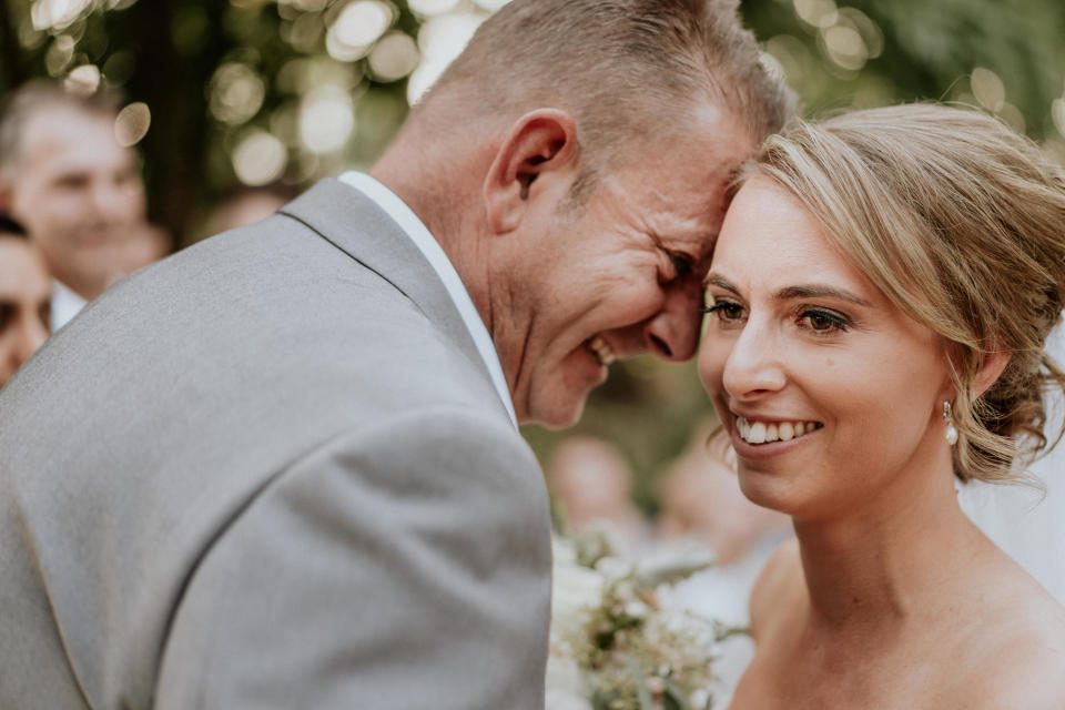 A close-up of the bride and groom's smiling faces, their foreheads touching. The groom is in profile, with the bride angled toward the camera. (Photo: <a href="https://www.jamesday.com.au/" target="_blank">James Day Photography</a>)