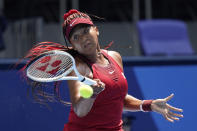 Naomi Osaka, of Japan, plays against Saisai Zheng, of China, during the first round of the tennis competition at the 2020 Summer Olympics, Sunday, July 25, 2021, in Tokyo, Japan. (AP Photo/Seth Wenig)