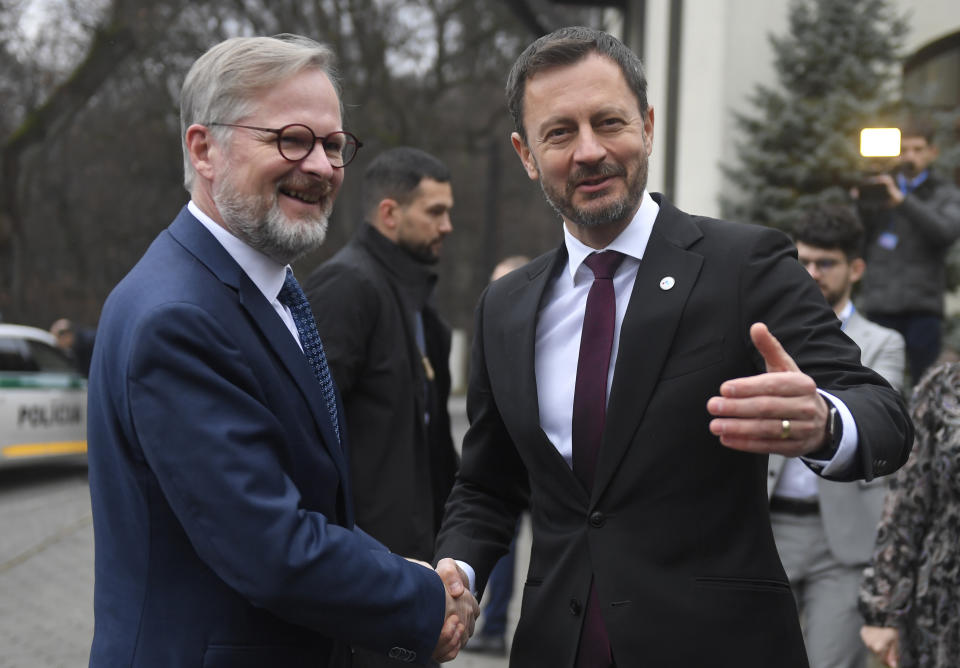 Slovakia's Prime Minister Eduard Heger, right, greets Czech Republic's Prime Minister Petr Fiala prior to the summit summit of Visegrad Group (V4) prime ministers in Kosice, Slovakia, Thursday Nov. 24, 2022. The leaders of the Visegrad Four group of Central European countries will discuss the current situation in Europe in the wake of the Russian aggression in Ukraine and the energy crisis. (Frantisek Ivan/TASR via AP)