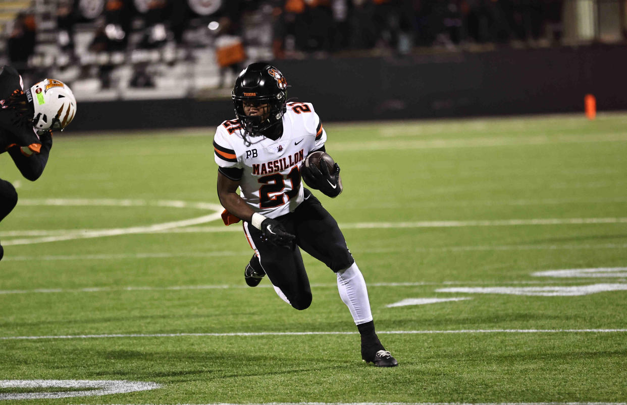 Massillon running back Ja'Meir Gamble carries the ball during a state semifinal against Anderson, Nov. 24, 2023.