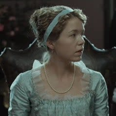 Anna Maxwell Martin as Cassandra Austen wearing a blue dress in Becoming Jane