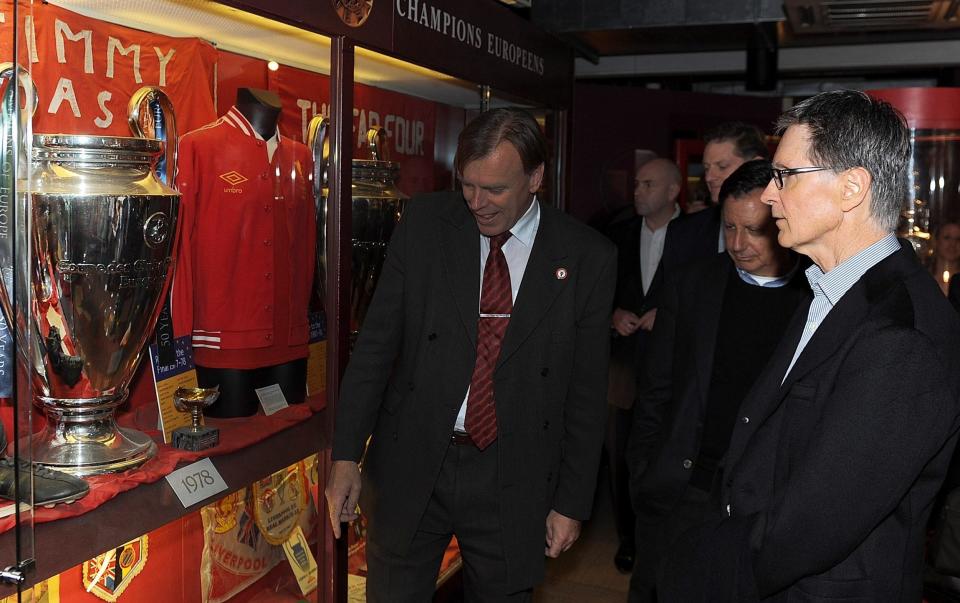 John W Henry admires Liverpool's trophy cabinet - Liverpool FC/Getty Images