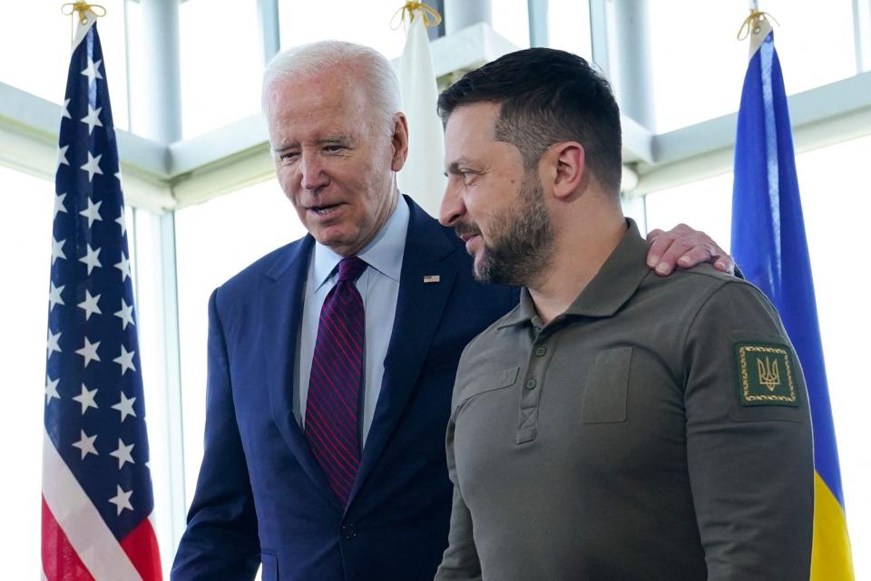 US President Joe Biden (L) walks with Ukraine's President Volodymyr Zelensky ahead of a working session on Ukraine during the G7 Leaders' Summit in Hiroshima on May 21, 2023.
