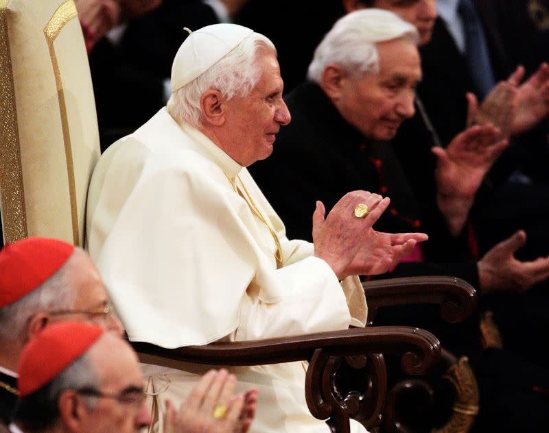 FILE PHOTO: Pope Benedict XVI and his brother, Bishop Ratzinger, applaud a classical music concert by Bayerischer Rundfunk at the Vatican