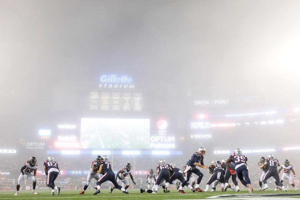 <p>Oct 22, 2017; Foxborough, MA, USA; New England Patriots quarterback Tom Brady (12) hands the ball off to running back Mike Gillislee (35) in the fog during the second half against the Atlanta Falcons at Gillette Stadium. Mandatory Credit: Greg M. Cooper-USA TODAY Sports TPX IMAGES OF THE DAY </p>